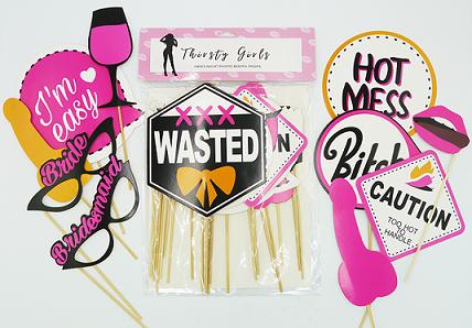 Collection of bachelorette party photo booth props with humorous text and graphics.