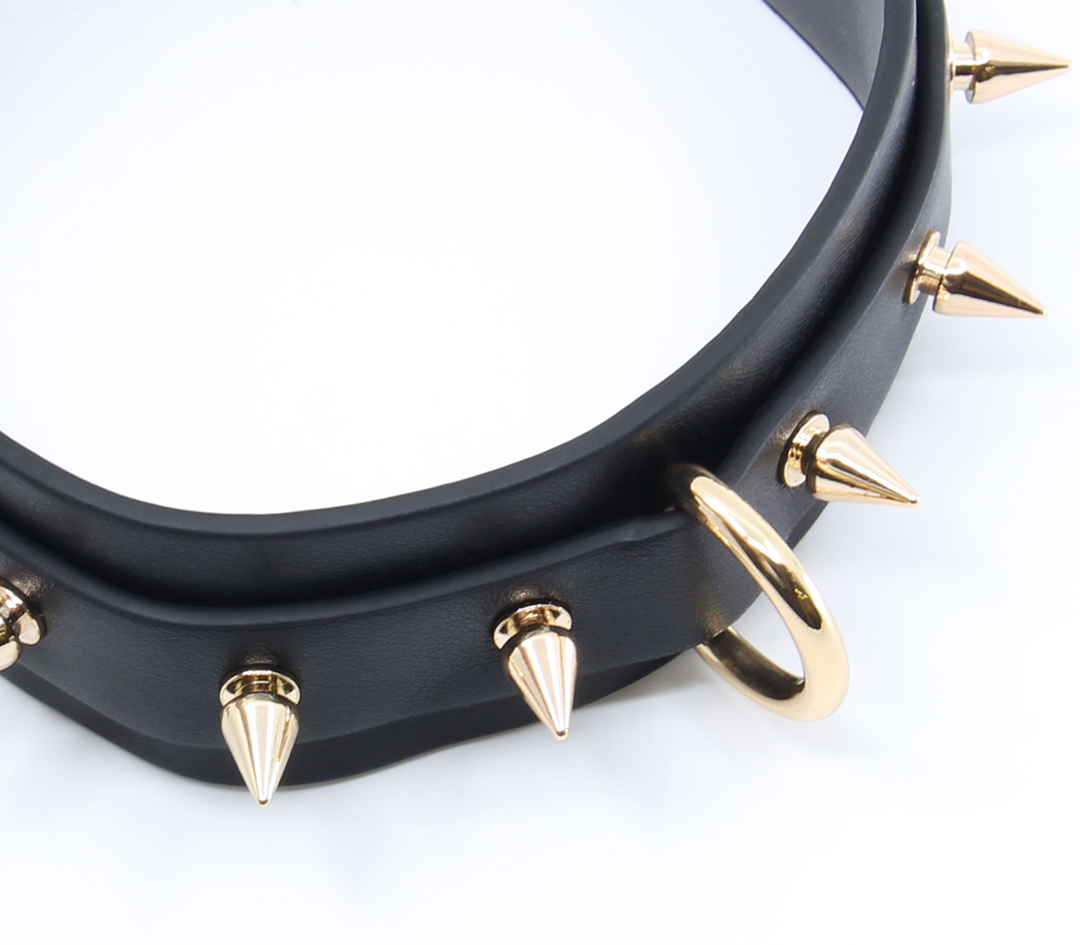 Premium spiked collar detail view - showing spike placement and leather construction for fetish play