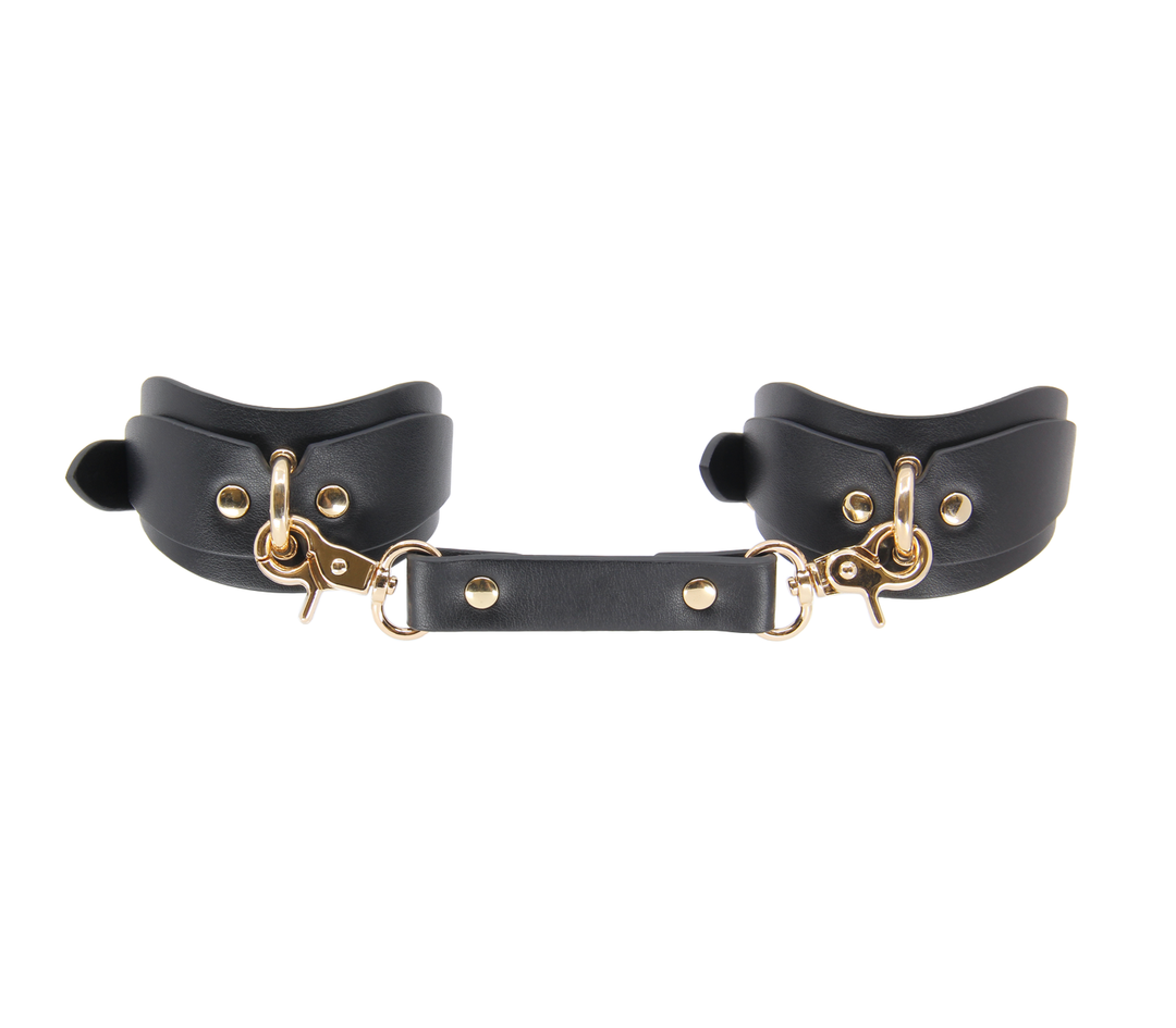 Love in Leather shaped wrist cuffs with gold hardware - ergonomic leather BDSM restraints