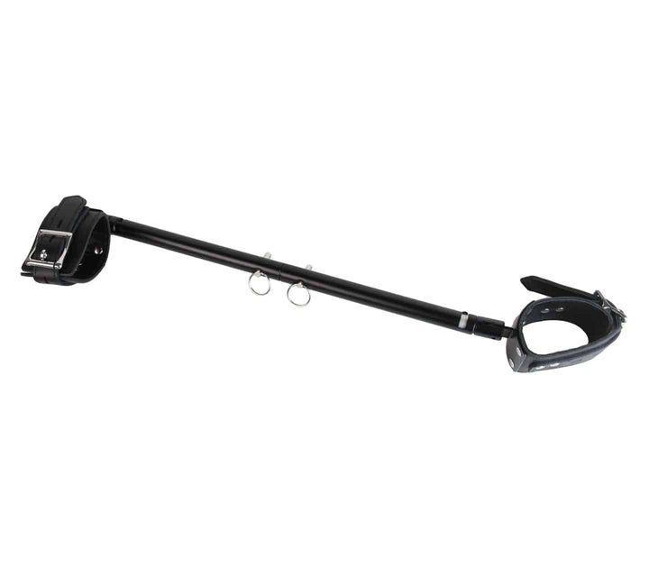 Adjustable spreader bar detail view - showing extendable mechanism and pivoting cuff attachments for BDSM play